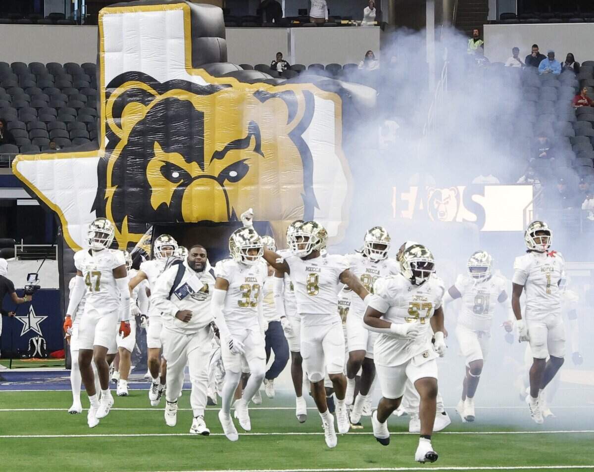 The South Oak Cliff Golden Bears enter the field to take on Richmond Thomas Randle during the first half of the UIL Class 5A Division II championship game on Saturday Dec. 20, 2025 at AT&T Stadium in Arlington, Texas.