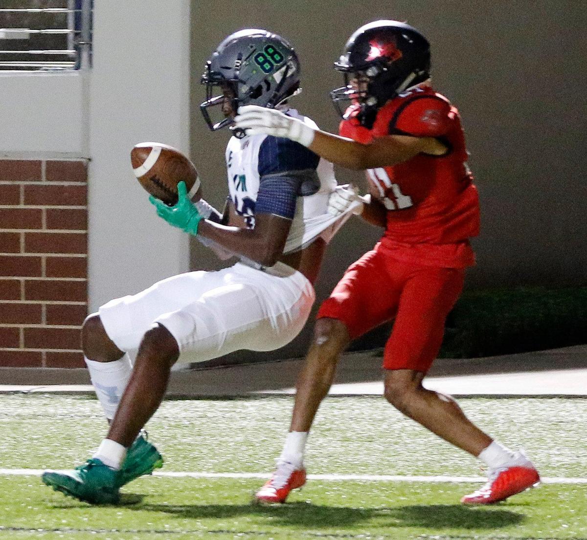 Eaton wide receiver Charles Whitebear (88) grabs a touchdown pass in front of Legacy’s Adin Newhouse (21) during a high school football game at Newsom Stadium in Mansfield, Texas, Thursday, Oct. 01, 2020. Eaton defeated Legacy 17-7. (Special to the Star-Telegram Bob Booth)