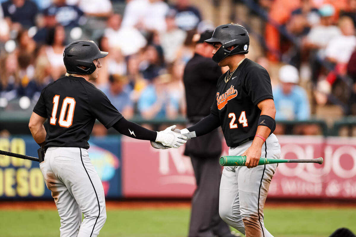 Aledo third baseman Dylan Duran (24) high fives left fielder Wilson Sehnem (10) after scoring against Montgomery Lake Creek in the UIL Class 5A Division I baseball state championship game on Friday, June 5, 2026, at Dell Diamond in Round Rock, Texas.