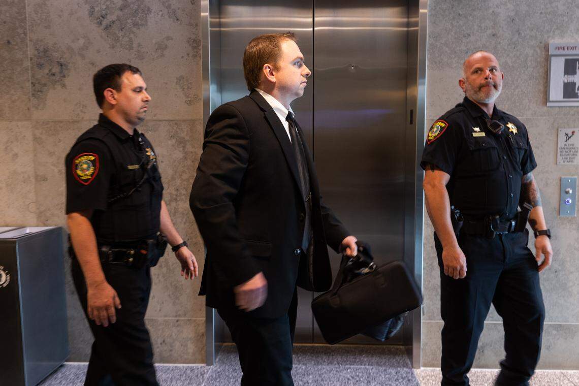 Aaron Dean, who is charged with the murder of Atatiana Jefferson, walks out of the courtroom after the third day of a pre-trial hearing on May 4, 2022, in Fort Worth. The trial was rescheduled for June 23.