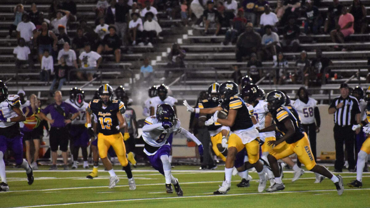 Fort Worth Arlington Heights faces off against Everman during a high school football game at Farrington Field in Fort Worth, Texas Friday, August 30, 2024.