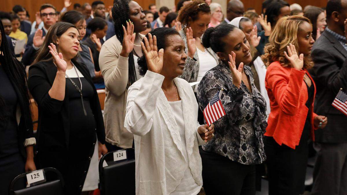 The oath of allegiance during a naturalization ceremony for new citizens in Washington, Sept. 10, 2019.