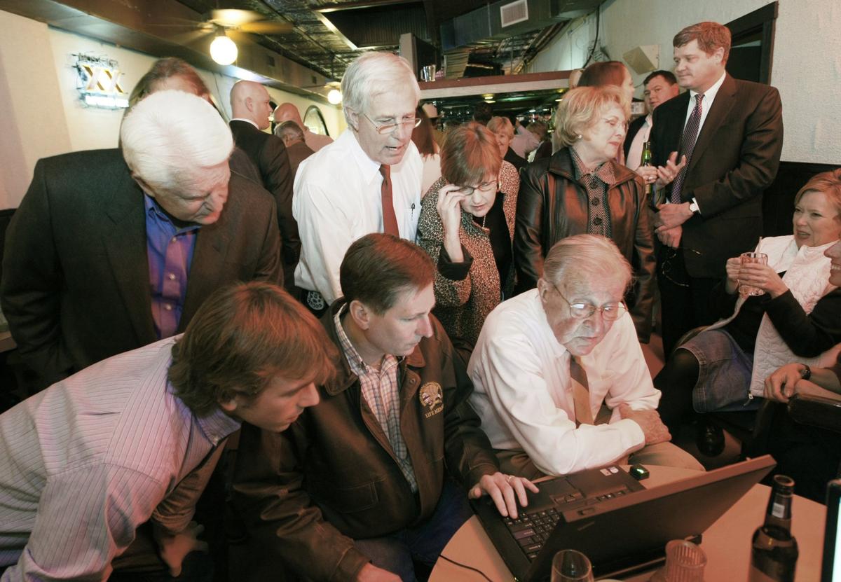 March 4, 2008: Texas Rep. Charlie Geren (top, second from left) looks over election returns with supporters at a victory party held at The Original Mexican Restaurant in Fort Worth.