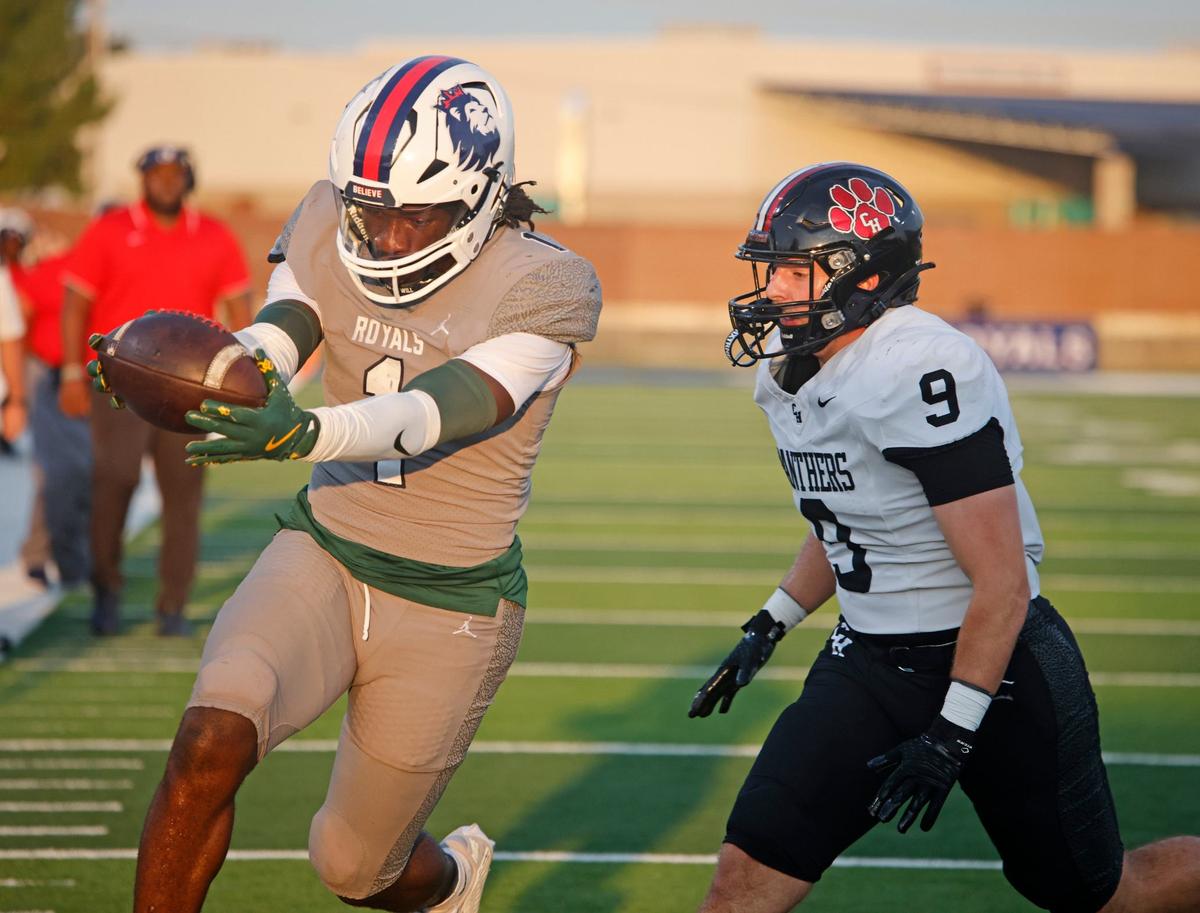 Richland running back Mike Turner (1) extends the ball as he crosses the goal line in front of Colleyville linebacker Madden Williams (9) during a UIL football game at Birdville Fine Arts and Activity Center in North Richland Hills Friday, Sept. 6, 2004.