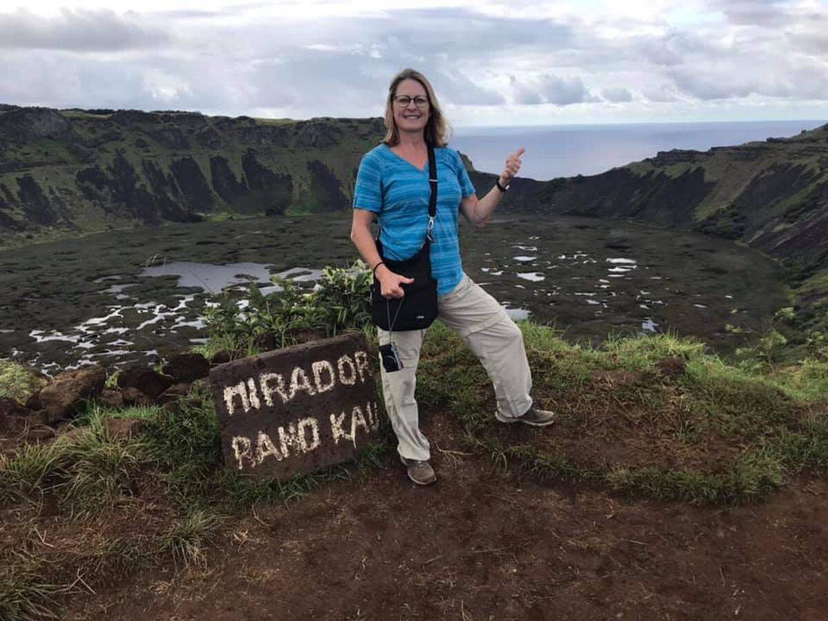 Dana Lindberg of Grapevine was on the last passenger cruise ship in the world to dock. She is pictured here on her trip around the world at the Easter Islands in the South Pacific on Feb. 10. Her journey began in Venice on Jan. 5, and ended on Friday in Genoa, Italy.