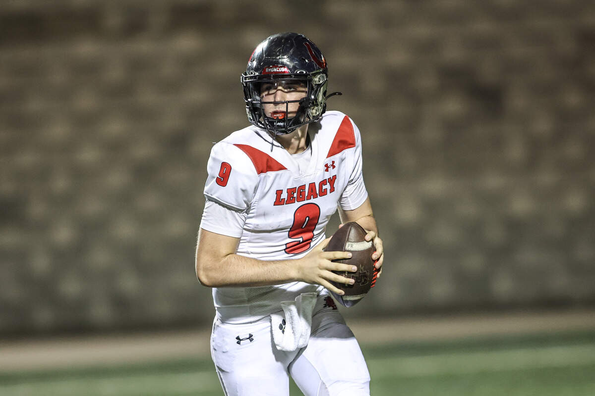 Mansfield Legacy quarterback Jake Jenkins looks to pass In Friday’s game at Vernon Newsom Stadium. Special to the Star-Telegram / Tom Marvin