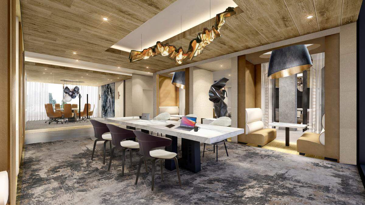 A luxury co-working space features a conference table and corner booths for work from home.