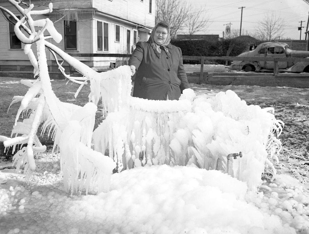 Jan. 5, 1947: “Mrs. Margaret McVeigh shown with ice formation on broken pipe.”