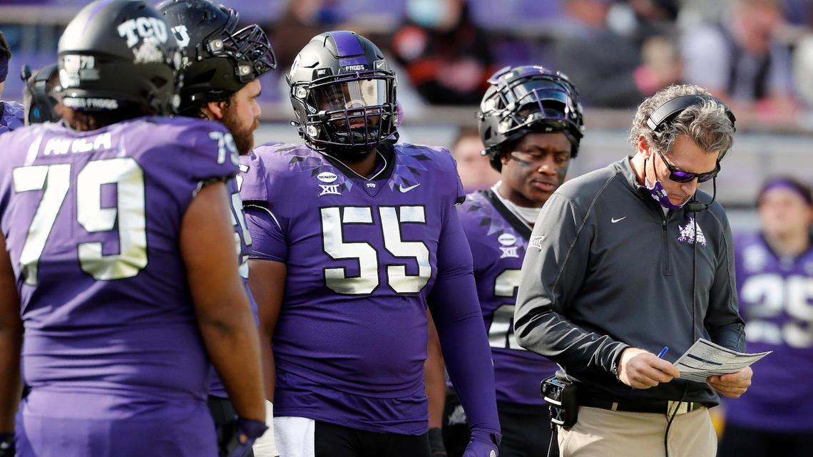 TCU play-caller Doug Meacham checks his play card in the second half of a NCAA football game at Amon G. Carter Stadium in Fort Worth, Texas, Saturday, Dec. 05, 2020. TCU defeated OSU 29-22. (Special to the Star-Telegram Bob Booth)