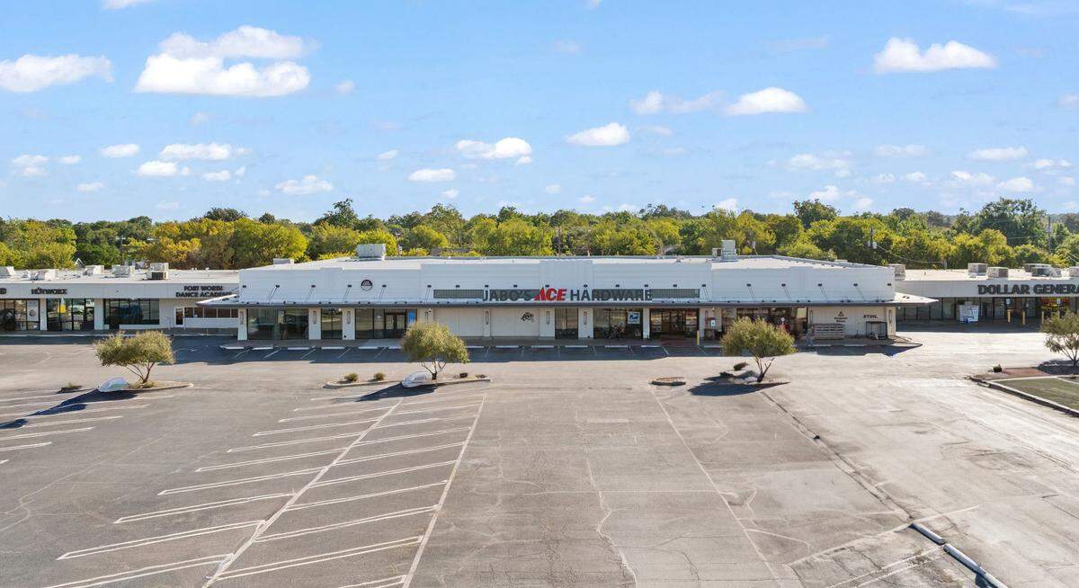 The restoration of the exterior of the Westcliff Shopping Center revealed the building’s original 1950s cast-stone facade, which had been preserved beneath a 1970s-era metal roof.