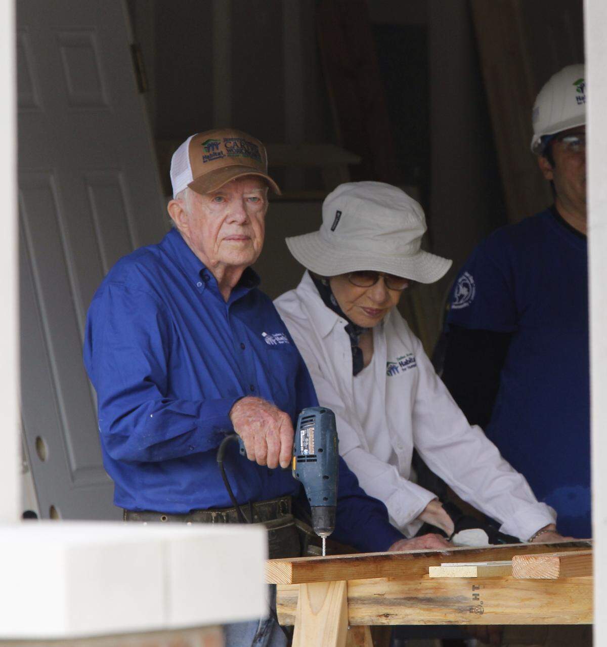 Former President Jimmy Carter and wife Rosalynn help build a house in east Fort Worth with Habitat for Humanity on Oct. 6, 2014.