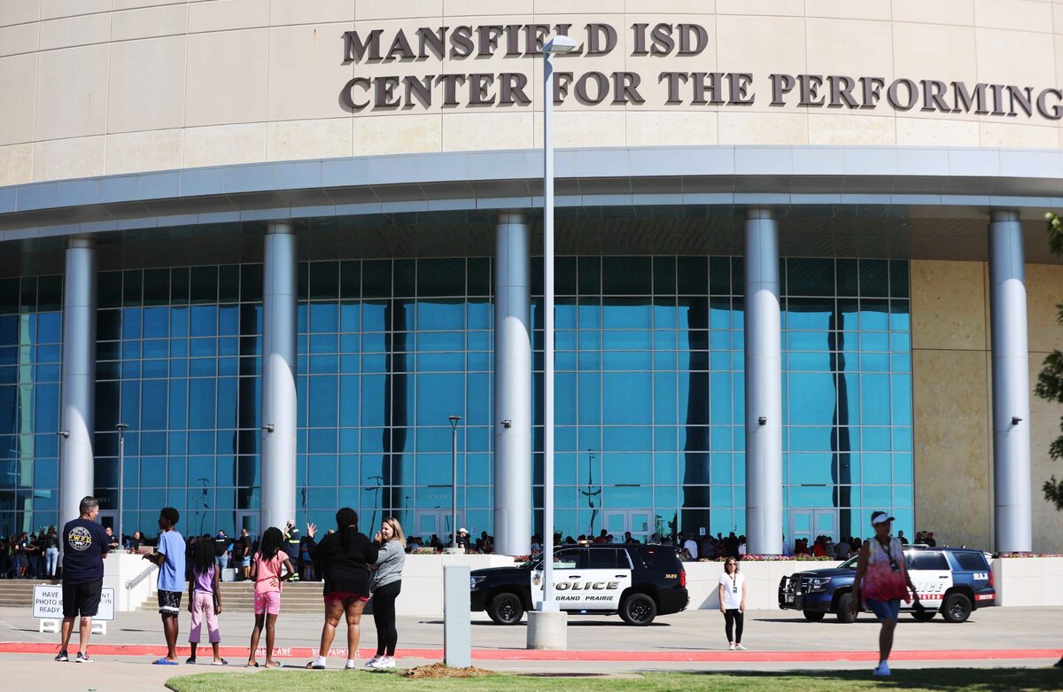 Parents were instructed to wait in a designated area near Timberview High School in Arlington after a shooting at the school.