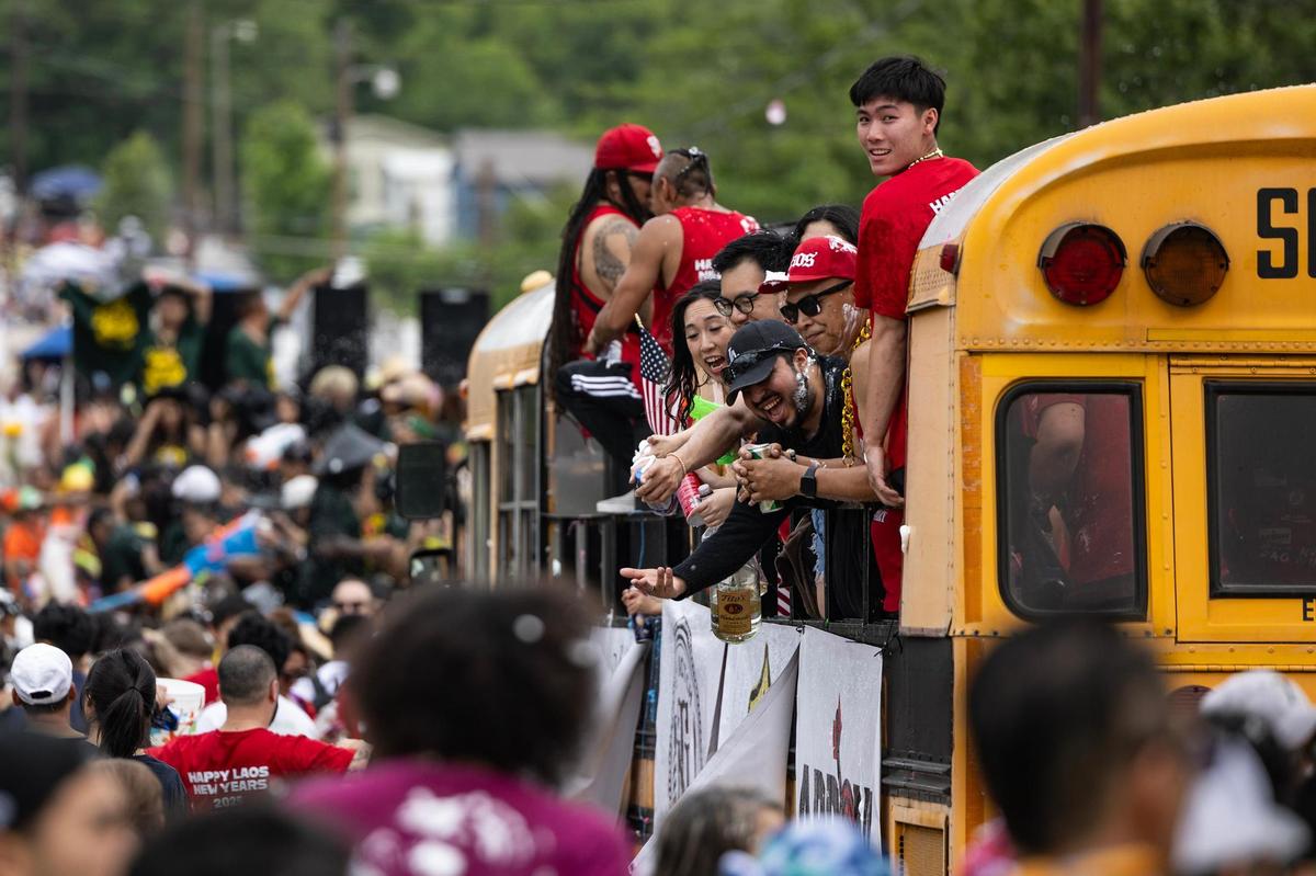 Tens of thousands of festival attendees flock the streets for the Lao New Year parade on the third day of the Lao New Year festival at Wat Lao Thepnimith Temple in Saginaw on Sunday, April 27, 2025.