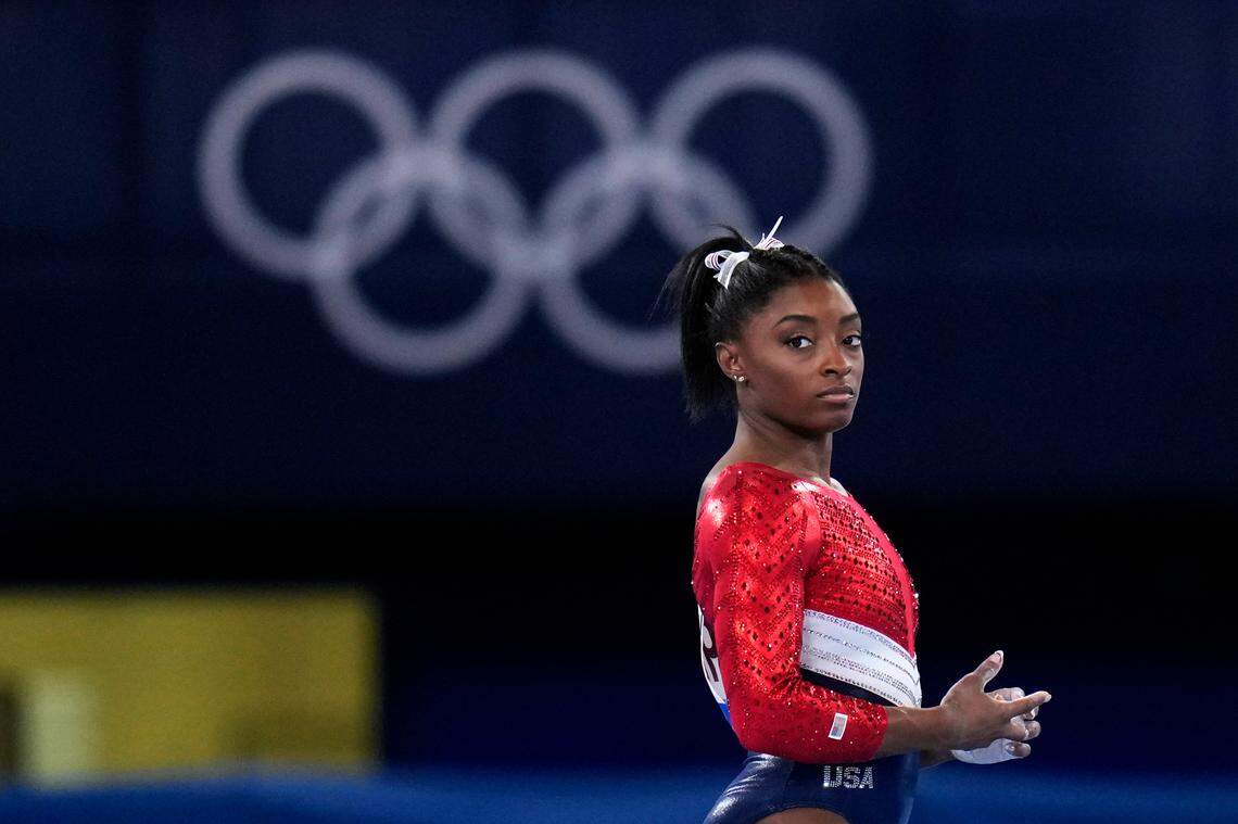 Simone Biles, of the United States, waits to perform on the vault during the artistic gymnastics women’s final at the 2020 Summer Olympics, Tuesday, July 27, 2021, in Tokyo. The American gymnastics superstar has withdrawn the all-around competition to focus on her mental well-being. (AP Photo/Gregory Bull)