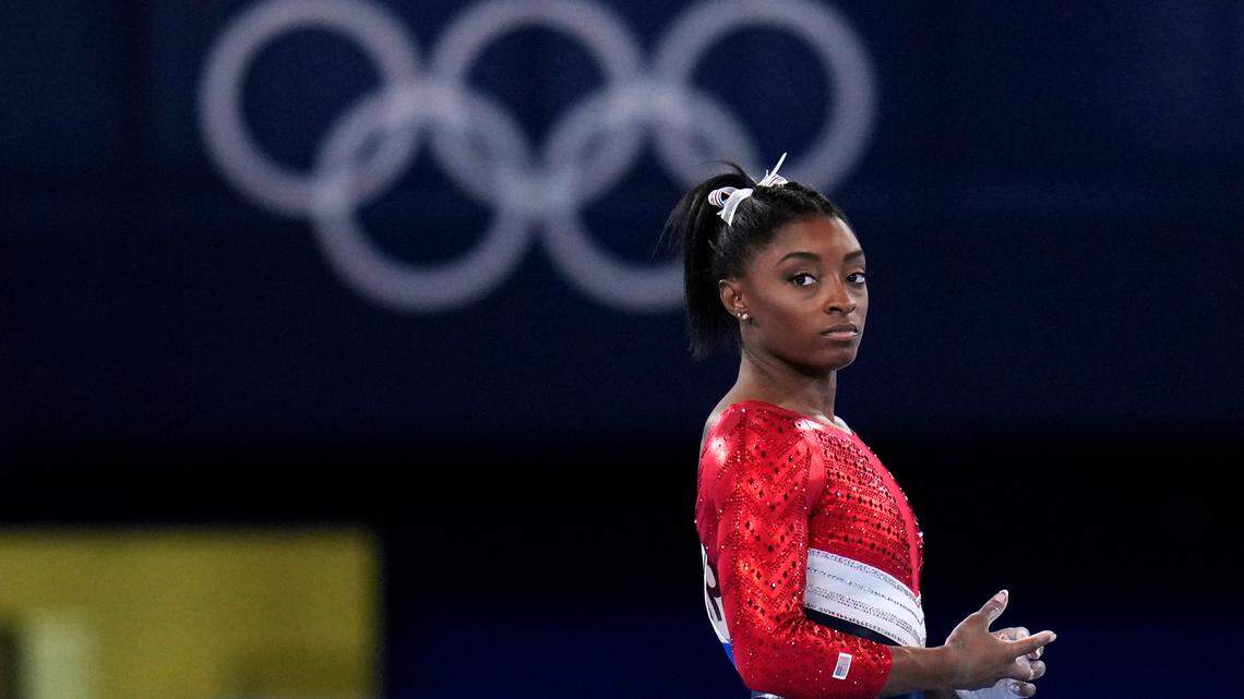 Simone Biles, of the United States, waits to perform on the vault during the artistic gymnastics women’s final at the 2020 Summer Olympics, Tuesday, July 27, 2021, in Tokyo. The American gymnastics superstar has withdrawn the all-around competition to focus on her mental well-being. (AP Photo/Gregory Bull)