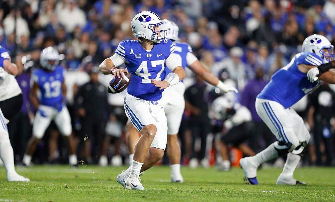 PROVO, UT - NOVEMBER 15: Bear Bachmeier #47 of the Brigham Young Cougars rolls out of the pocket to throw a pass against the Texas Christian University Horned Frogs during the first half of their game at LaVell Edwards Stadium on November 15, 2025 in Provo, Utah. (Photo by Chris Gardner/Getty Images)