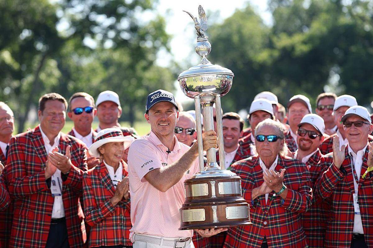 Russell Henley holds the trophy after winning the Charles Schwab Challenge on Sunday at Colonial Country Club in Fort Worth.