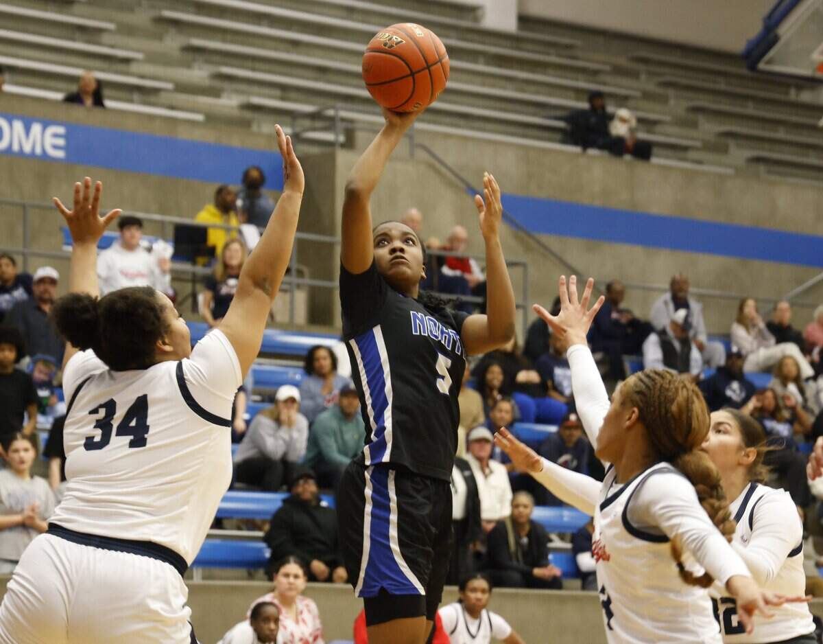 North Crowley guard Kori Singleton (5) drops In a bucket heavily defended by Allen during the first half of a UIL Class 6A Division I girls regional semifinals basketball playoff game at Grand Prairie High School in Grand Prairie, Texas, Tuesday Feb. 24, 2026.