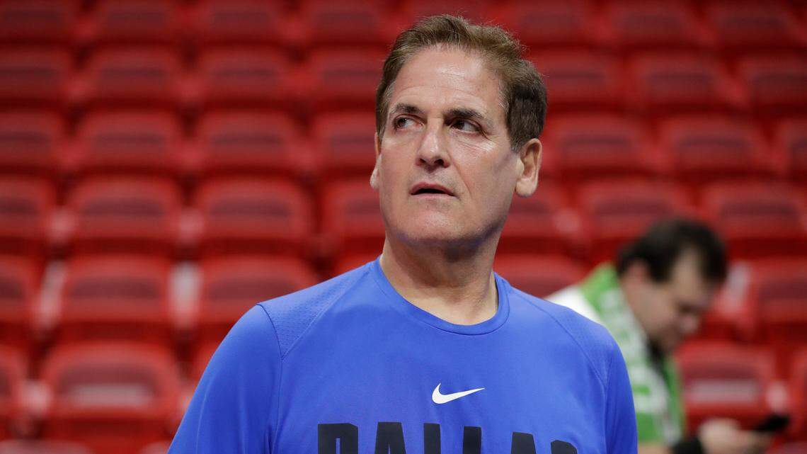 Dallas Mavericks owner Mark Cuban watches players warm up before the start of an NBA basketball game against the Miami Heat, Friday, Feb. 28, 2020, in Miami. (AP Photo/Wilfredo Lee)