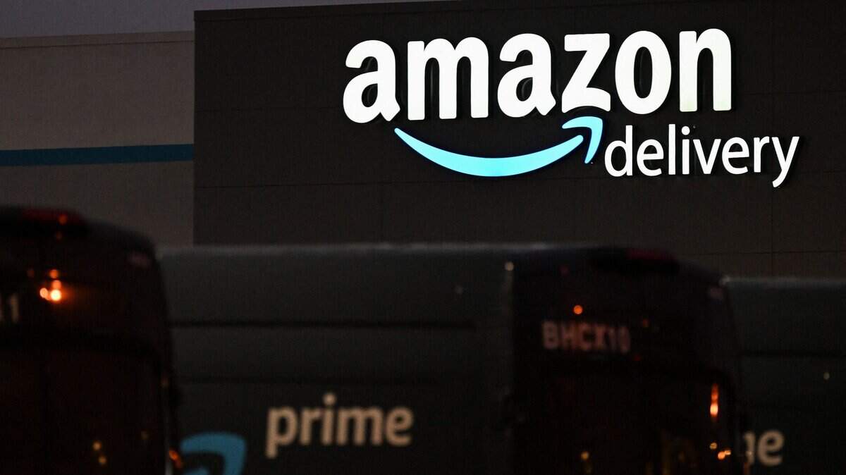 An Amazon sign is displayed outside of an Amazon.com Inc. delivery hub in the late evening of Amazon Prime Day, July 12, 2022, in Culver City, California.