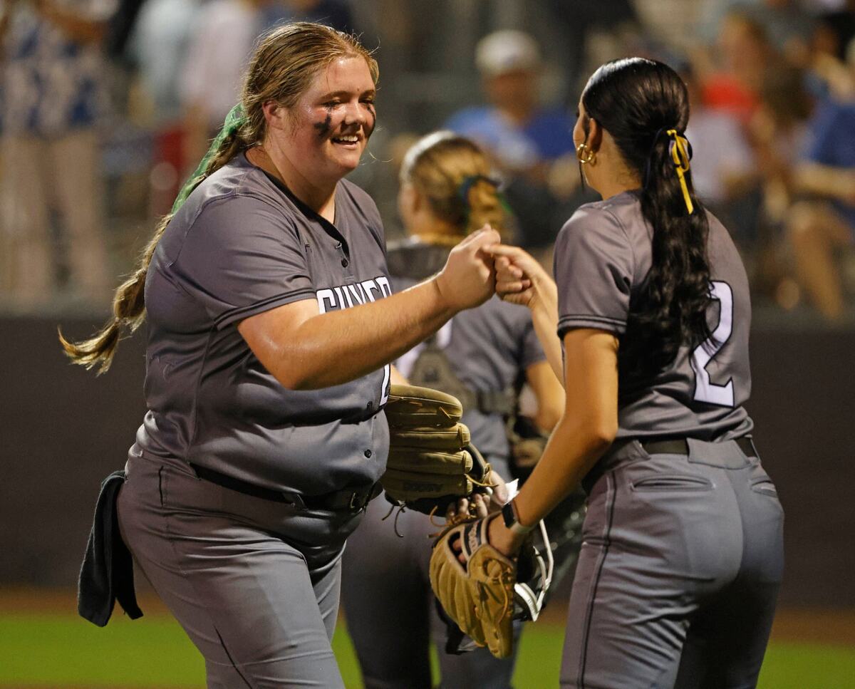 Guyer’s Jenna Osborne (2) congratulates pitcher Finley Montgomery (20) as Montgomery leaves the field after the sixth inning during the Conference 6A Region 1 Regional Finals at Coppell Softball Field in Coppell, Texas, Saturday May 25, 2024.