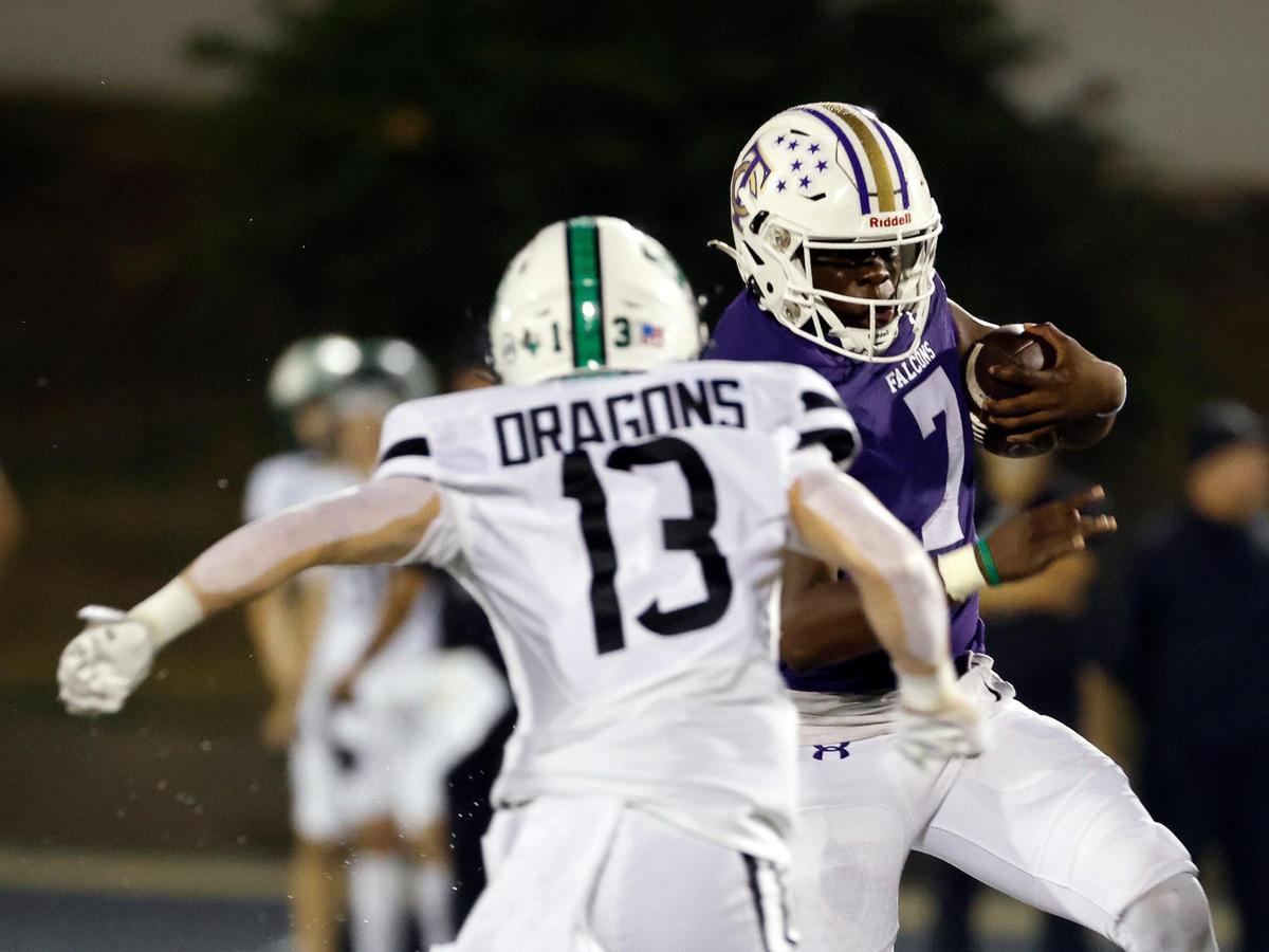 Timber Creek quarterback Lior Mendji (7) attempts to avoid the tackle of Carroll defensive back Trey Ferri (13) in the first half of a UIL high school football game at Keller ISD Stadium in Keller, Texas, Thursday, Sept. 14, 2023.