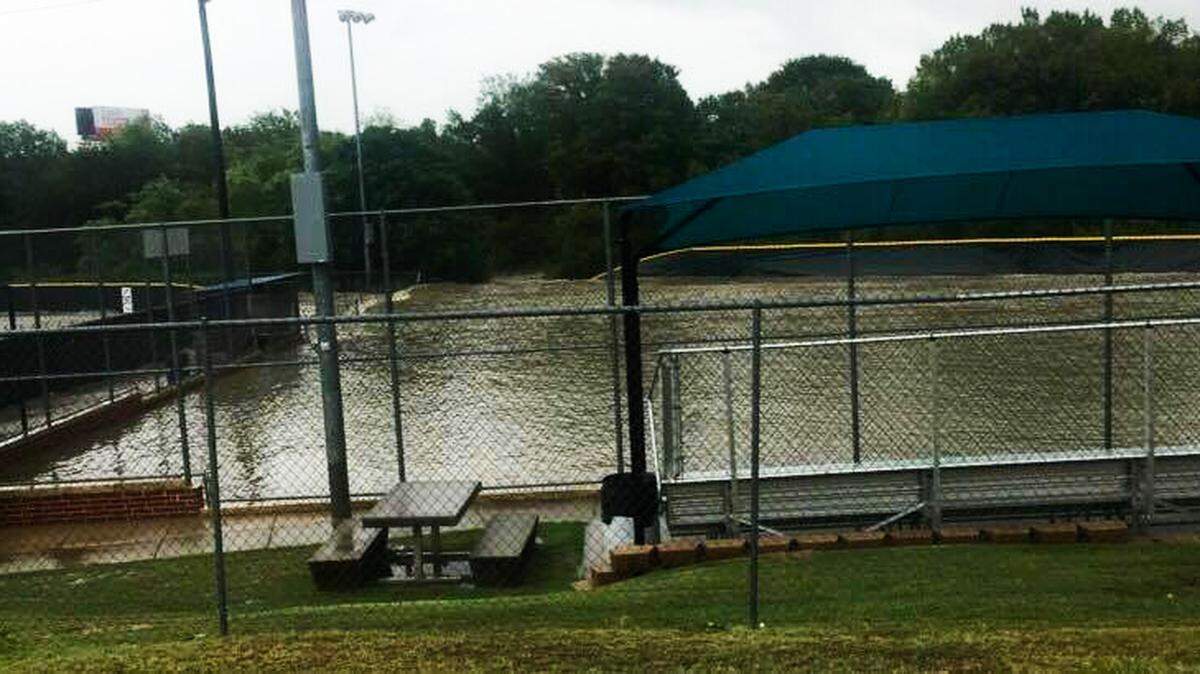 Youth baseball fields were severely damaged last week by several feet of flash flood water.