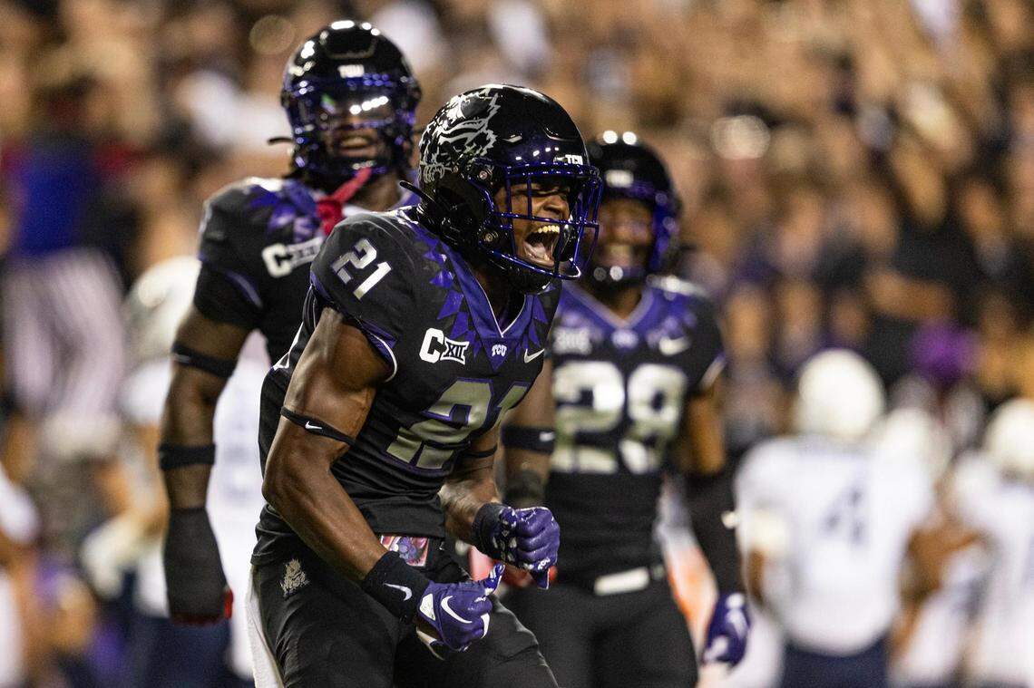TCU safety Bud Clark (21) celebrates after an interception in the first quarter of a Big XII conference game between the TCU Horned Frogs and the West Virginia Mountaineers at Amon G. Carter Stadium in Fort Worth on Saturday, Sept. 30, 2023. The interception was later overturned.