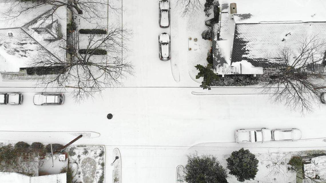 A layer of snow coats the ground in the Fairmount neighborhood of Fort Worth on Feb. 14, 2021.