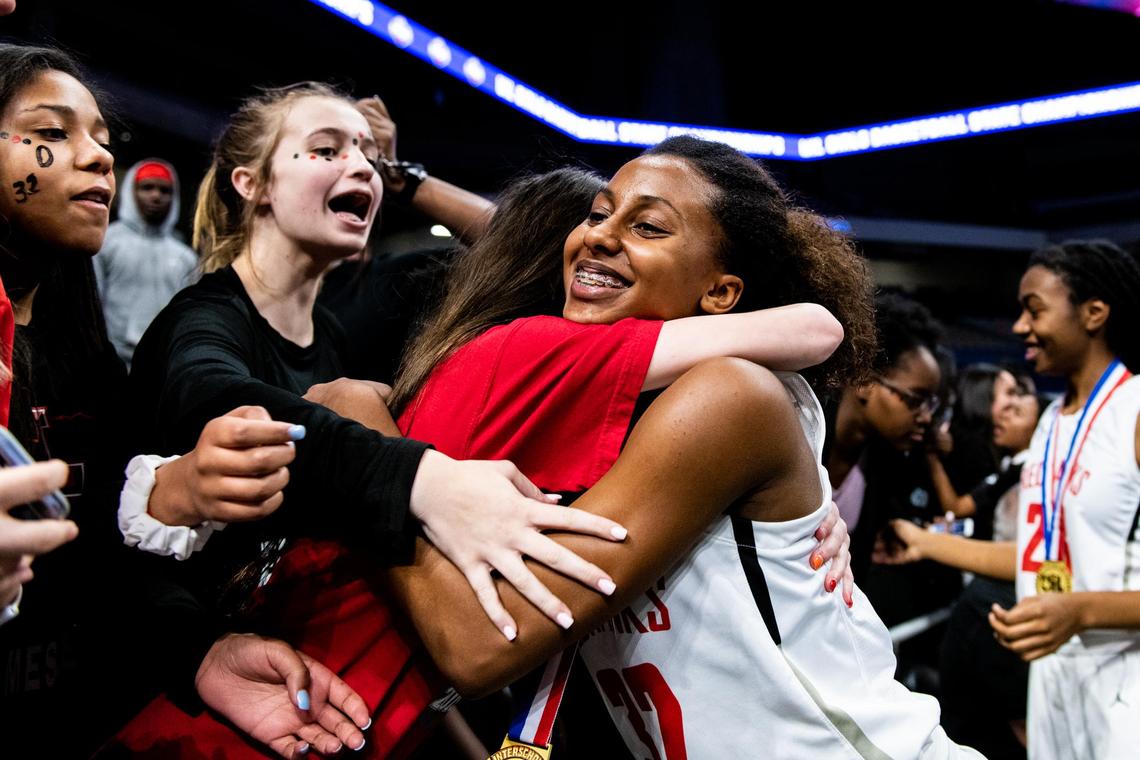 Isabella Copeland (32) hugs those in the stands after the Redhawks defeated San Antonio Veterans Memorial 35-26, in the 5A State Championship game at the Alamodome in San Antonio on March 7th, 2020. (Matt Smith: Special to the Star-Telegram).