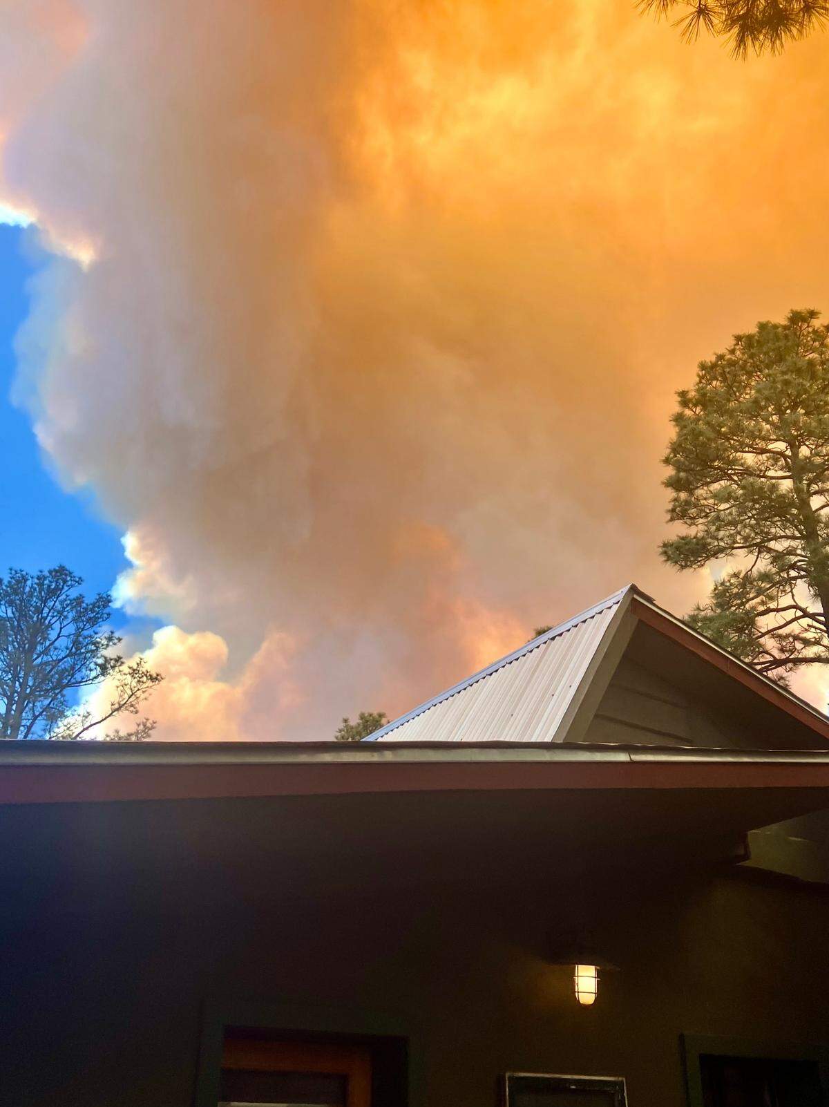 Flames leap above Joe Corpening’s house in Ruidoso, New Mexico in a fire May 18, 2024. The house was eventually destroyed.