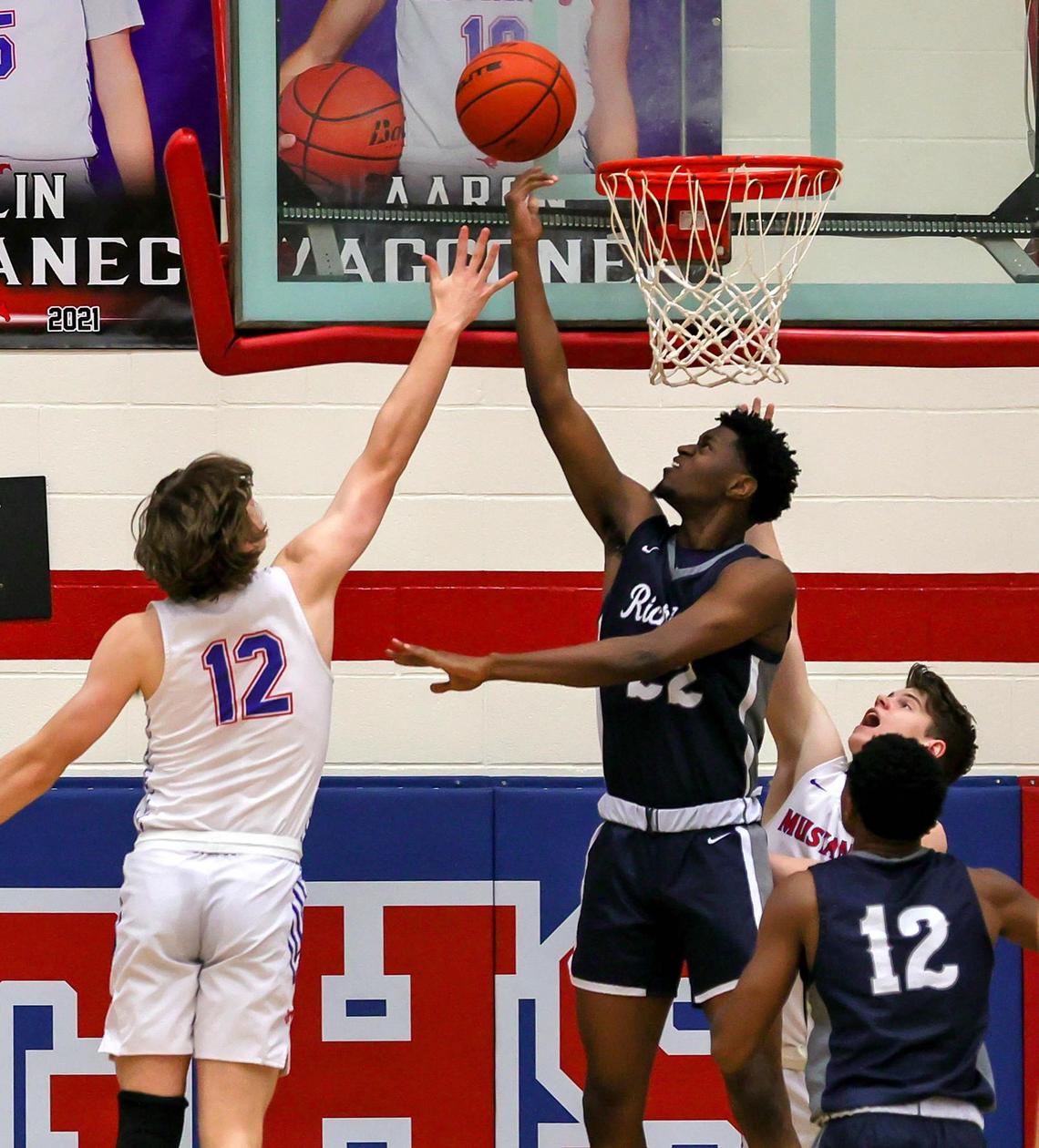 Richland forward Kyron Walton (22) puts up a shot against Grapevine guard DJ Catalano (12) during the first half of a High School basketball game, January 25, 2021, played at Grapevine High School in Grapevine, Tx. (Steve Nurenberg Special to the Star-Telegram)