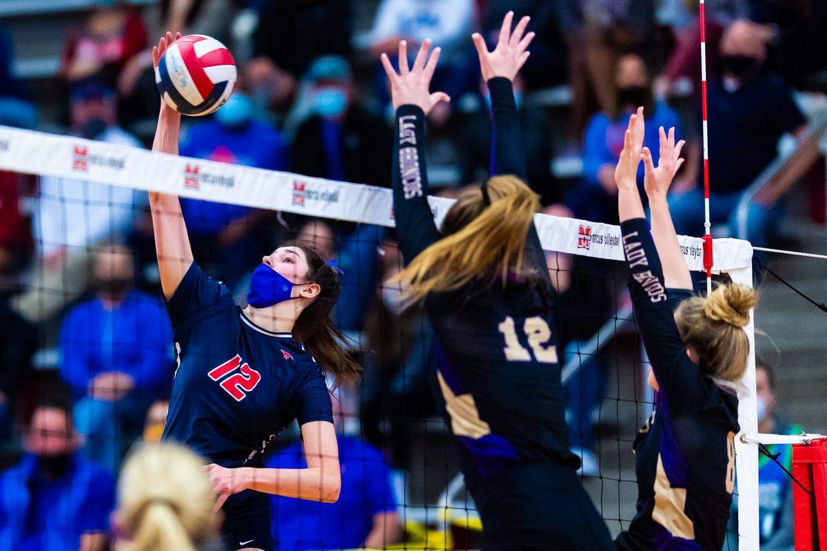 Grapevine junior Janet deMarrais goes for a kill against Denton during the 2020 season. The Mustangs reached the state semifinals for the first time (Matt Smith/Star-Telegram)