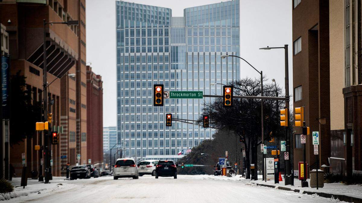 East Belknap Street and the new Fort Worth City Hall are covered with snow after the region got another one to three inches of snow Wednesday, Feb. 17, 2021, in Fort Worth.