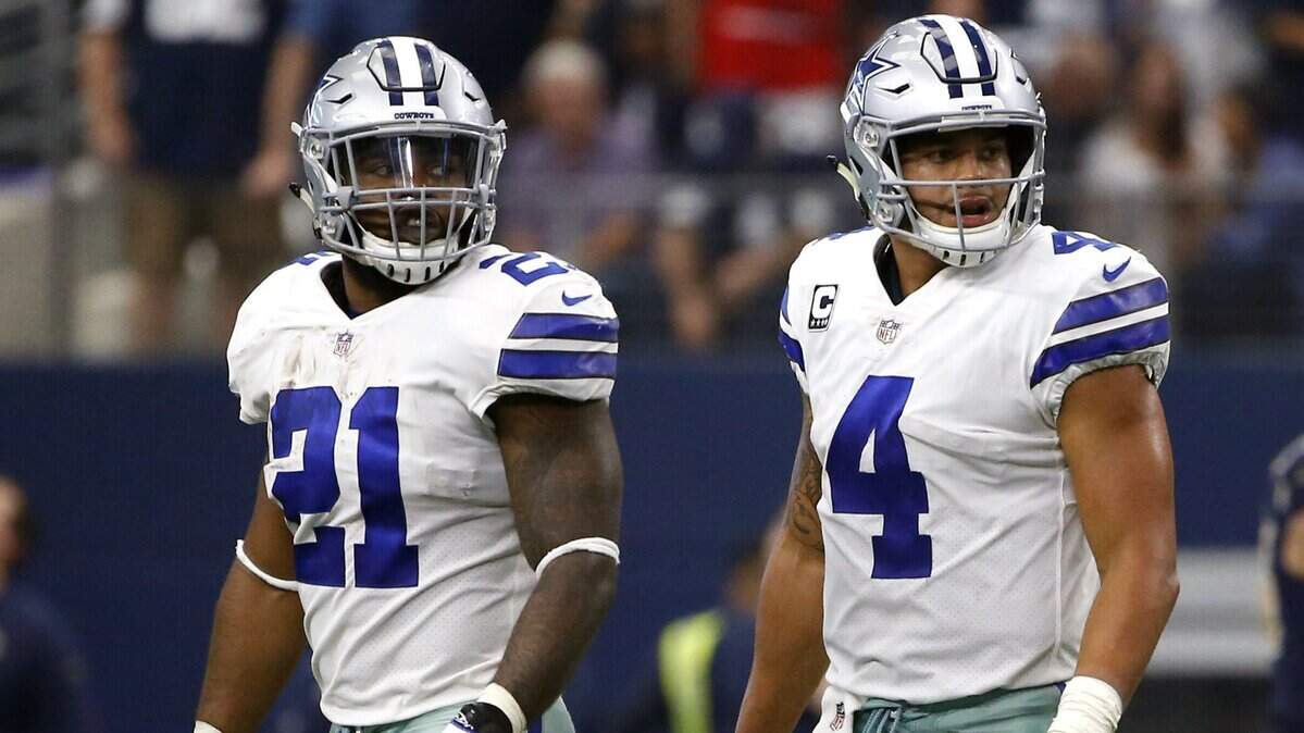 Dallas Cowboys running back Ezekiel Elliott (21) and quarterback Dak Prescott (4) walk off the field in 2017. The 2018 National Fantasy Football Convention will run Friday through Sunday at the Will Rogers Memorial Center in Fort Worth. Elliott and Tony Romo are co-owners of this football fan showcase.