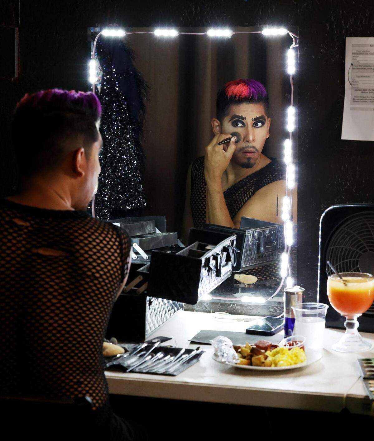 Patrick Mikyles puts on his makeup while preparing for his interactive drag show, Drag With Me Brunch, at Red Goose Saloon in downtown Fort Worth on Saturday, June 3, 2023. To avoid potential protests at the venue he switched his show to 18+.