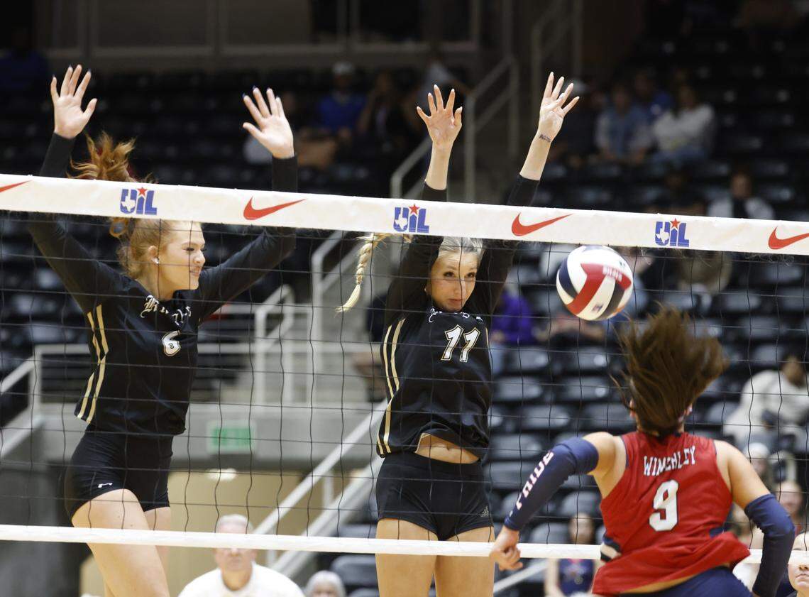 Fort Worth Eagle Mountain outside hitter Brooke Lacewell (6) and middle blocker Rylinn Roberts (11) block the shot back into Wimberley outside hitter Lilli Sandoval (9) during the second set of the UIL Class 4A Division II state volleyball championship game Friday Nov. 21, 2025 at Curtis Culwell Center in Garland, Texas.