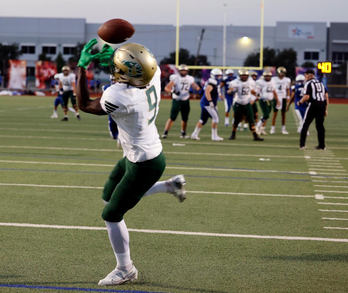 Birdville wide receiver Brian Kent (9) grabs a touchdown pass for the fourth touchdown in the first half of a UIL football game at Standridge Stadium in Carrollton, Texas, Thursday Sept. 07, 2023. Birdville led 27-12 at the half. (Special to the Star-Telegram Bob Booth)
