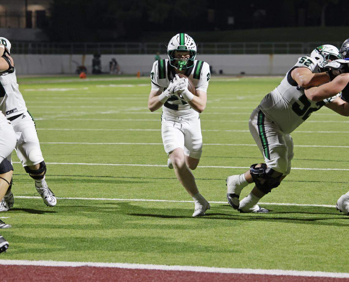 Southlake running back Brooks Biggers (24) gets a big hole up the middle for a touchdown during the first half of a UIL football game between Southlake Carroll  and Byron Nelson at Northwest ISD Stadium in Justin, Texas, Friday, Sept. 12, 2025.