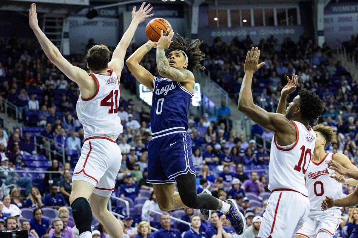 TCU guard Micah Peavy (0) goes up for a contested fast break layup during the second half against the Cincinnati Bearcats at Schollmaier Arena in Fort Worth on Saturday, Feb. 24, 2024.