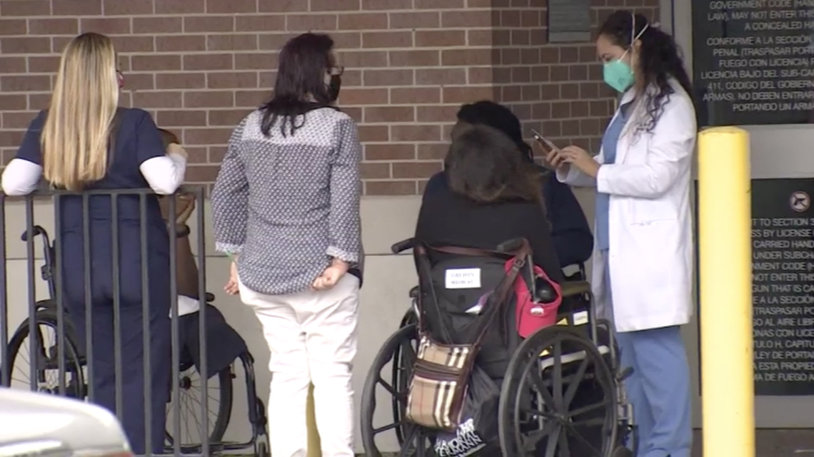 Doctors treated patients, including a woman who had COVID-19, in the parking lot of The Heights Hospital in Houston after a dispute over unpaid rent. Screengrab from KHOU.