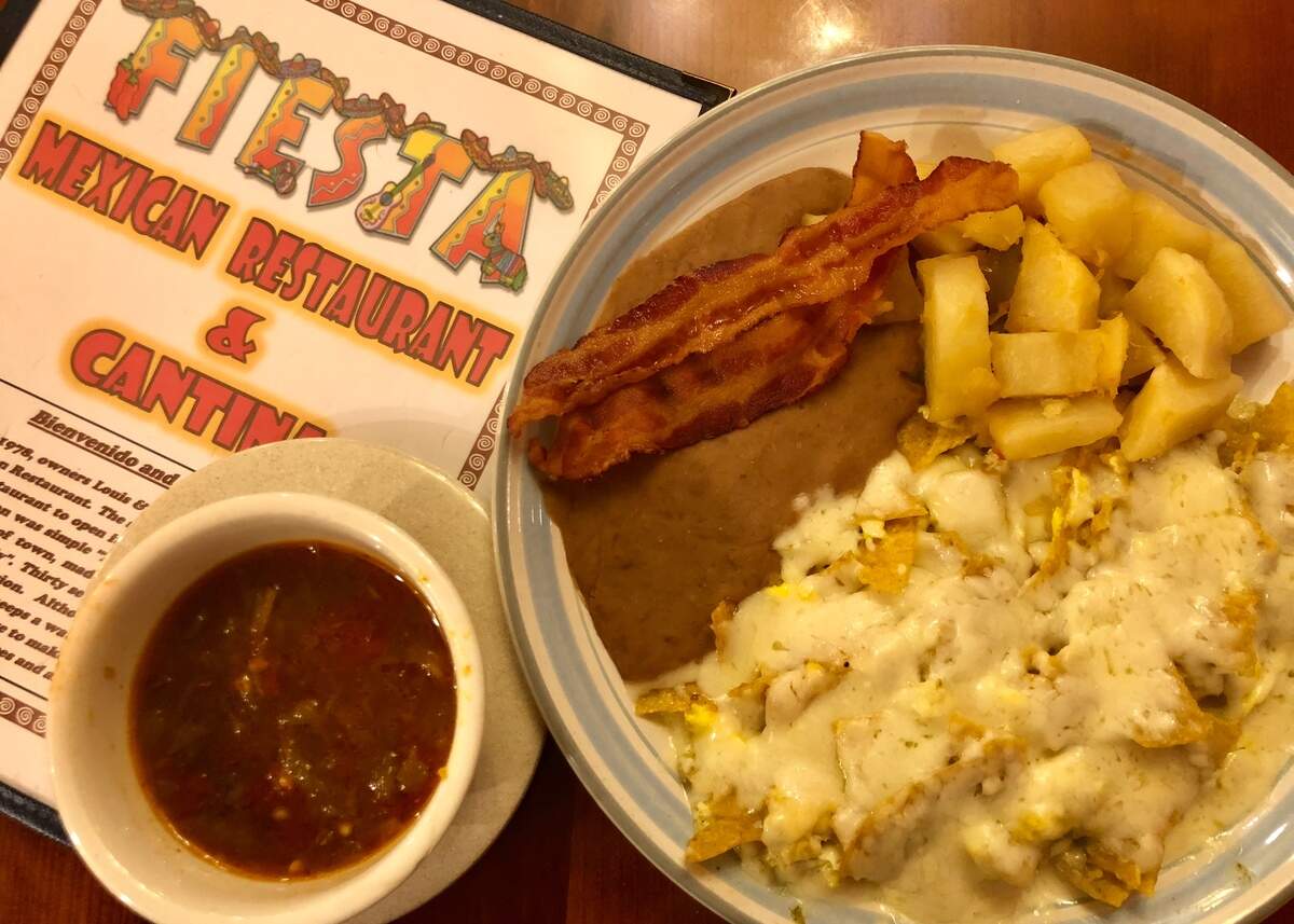 Chilaquiles verdes with salsa ranchera on the weekend breakfast menu at Fiesta Mexican Restaurant.