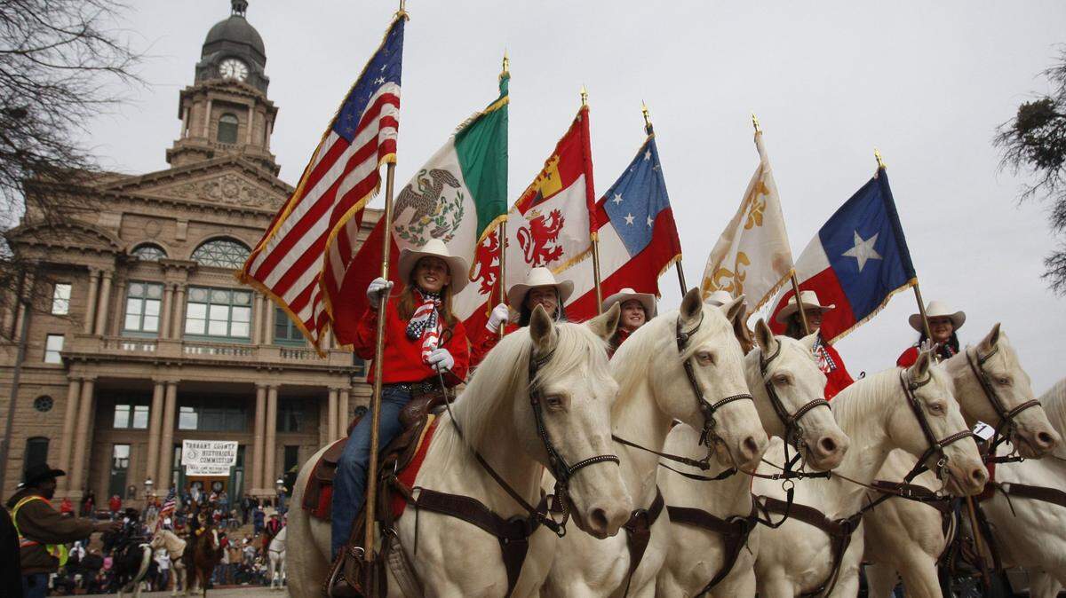 Bearing the six flags of Texas’ history the Hardin Simmons University Six White Horses ride in the Fort Worth Stock ShowÕs ÒAll Western ParadeÓ in downtown Fort Worth January 16, 2009. (Special to the Star-Telegram/ Richard W. Rodriguez)1