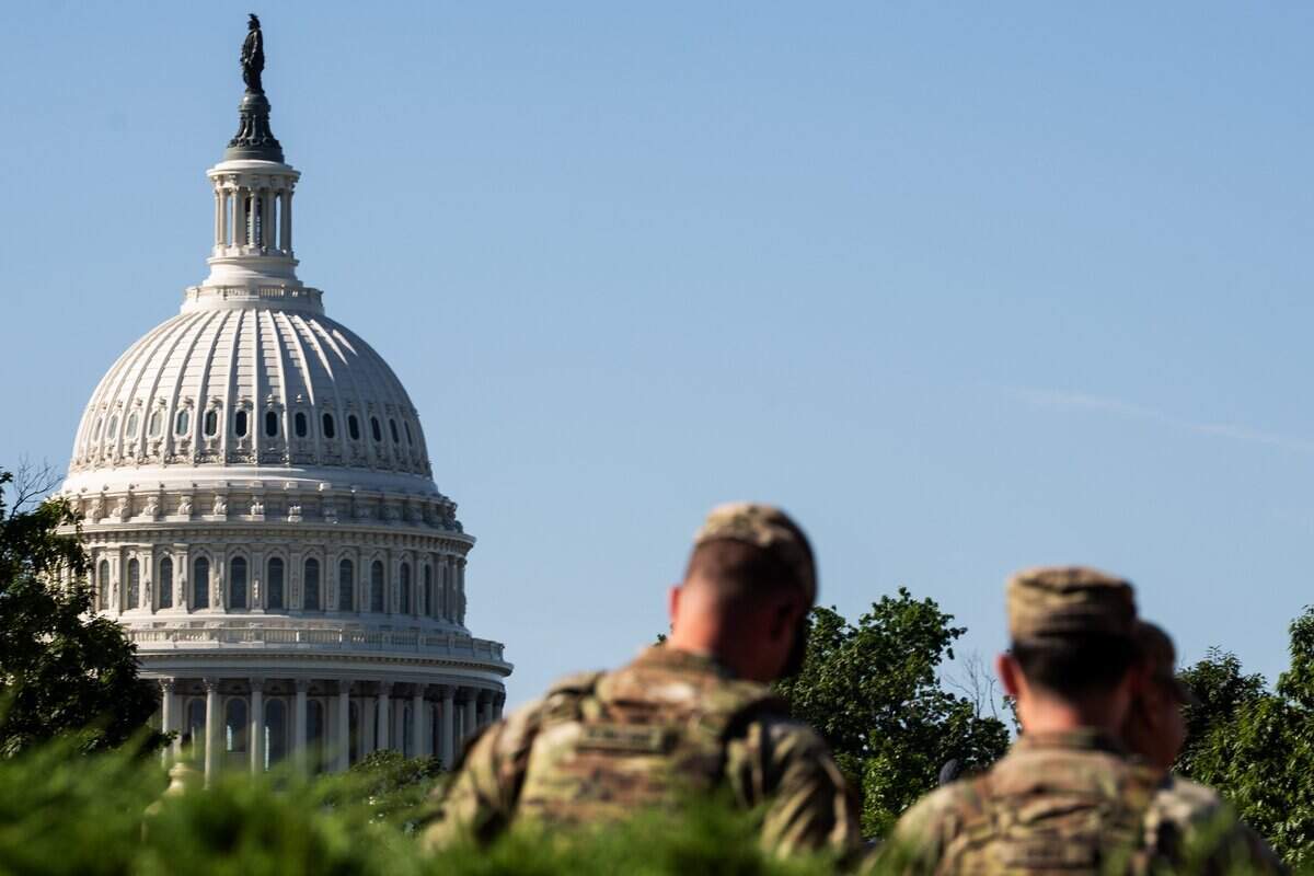 Aug 26, 2025; Washington, DC, USA; Aug. 26, 2025; Members of the Louisiana National Guard patrol the perimeter of Union Station in Washington D.C. as President Donald Trump's deployment of National Guard troops and federal takeover of Metro Police Department continues Tuesday, Aug. 26, 2025. National Guard troops began carrying M17 pistols and M4 rifles over the weekend for self-defense.. Mandatory Credit: Josh Morgan-USA TODAY
