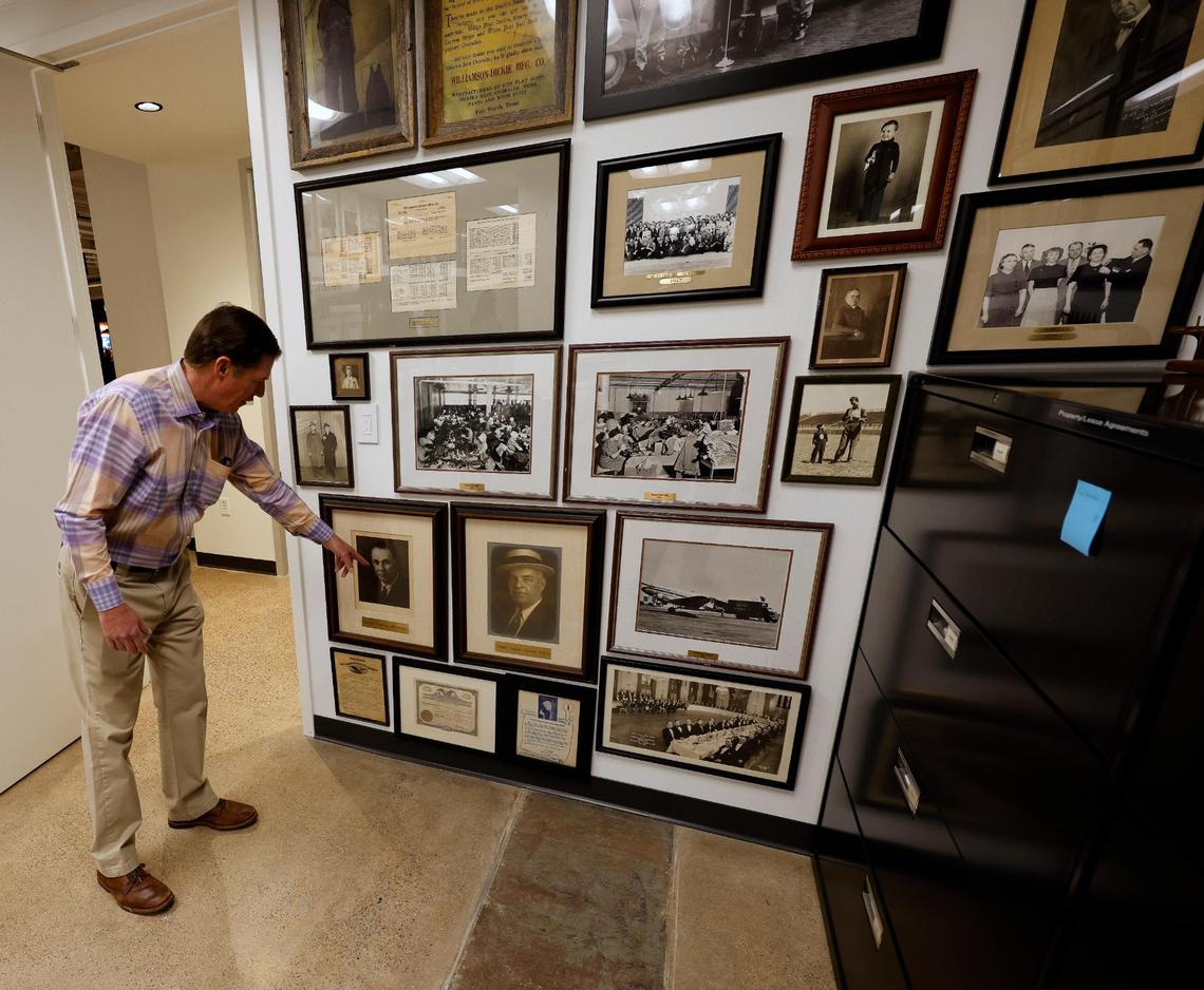 Brand Ambassador Philip Williamson points out his grand father and great grandfather in an archives room at Dickies offices in downtown Fort Worth Texas, Thursday Mar. 28, 2024. The 102 year old work apparel company recently relocated to downtown Fort Worth. (Special to the Star-Telegram Bob Booth)