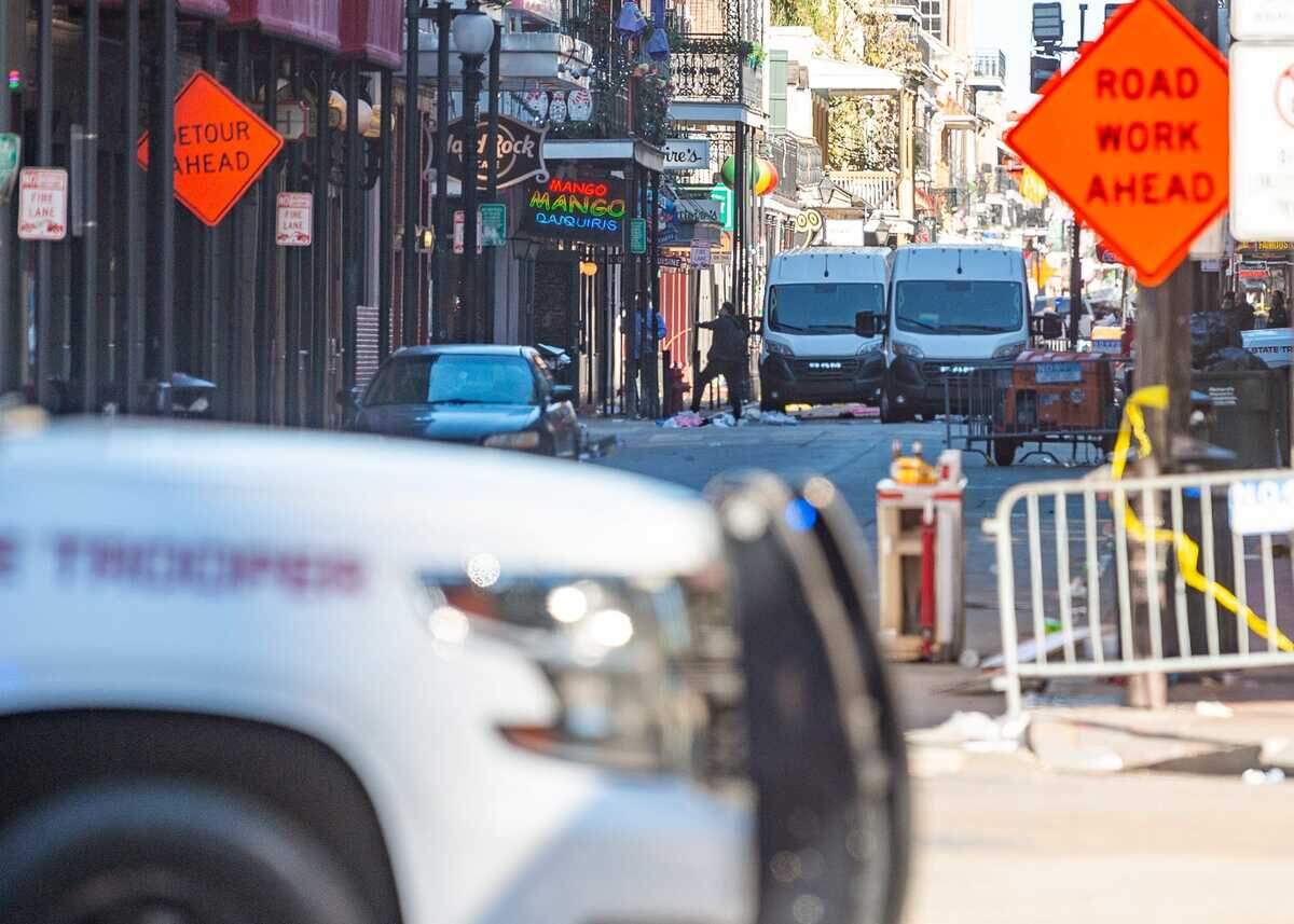 New Orleans Parish Coroner vans on Bourbon Street in New Orleans, Louisiana, following an attack in the French Quarter on Wednesday, Jan. 1, 2025.