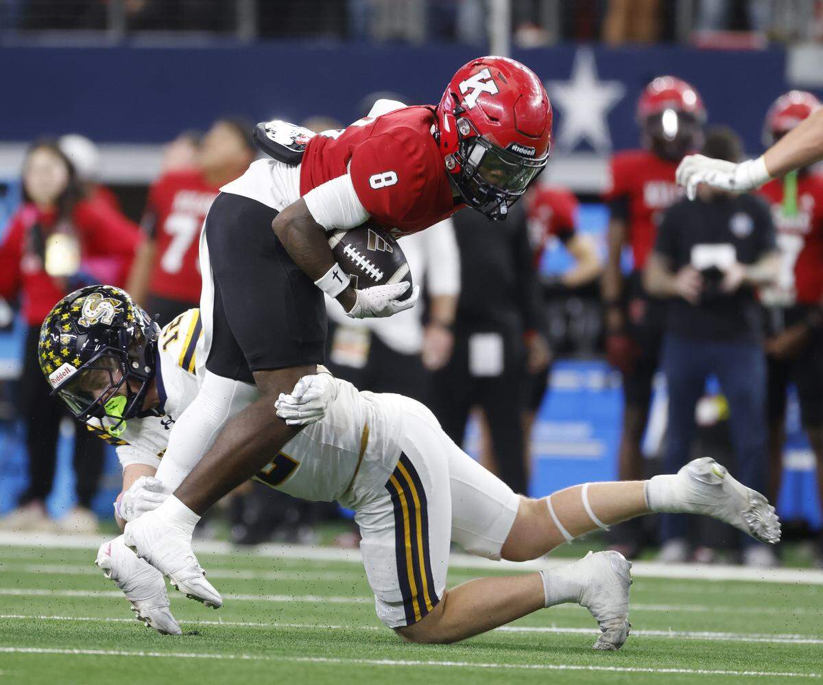 Stephenville strong safety Cooper Rudd (12) wraps up Kilgore running back Rayshaun Williams (8) after the catch during the first half of the UIL Class 4A Division I championship game on Friday Dec. 19, 2025 at AT&T Stadium in Arlington, Texas.