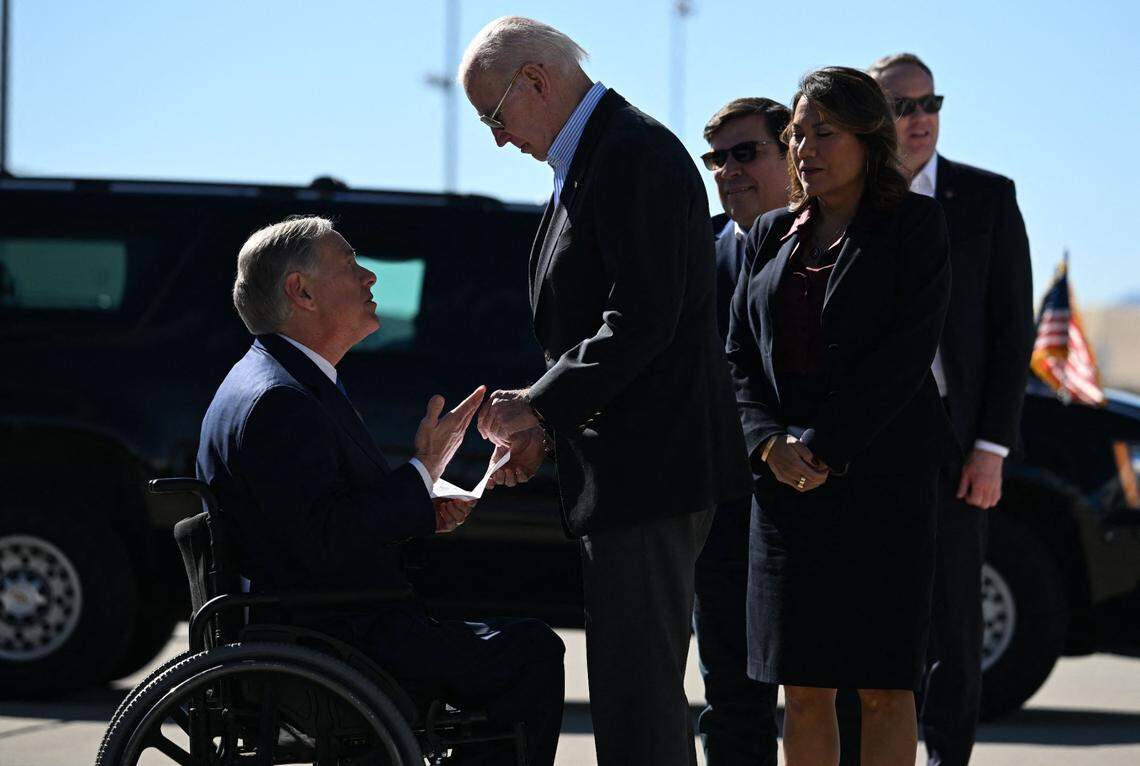 US President Joe Biden is greeted by Texas Gov. Greg Abbott upon arrival at El Paso International Airport in El Paso, Texas, on Jan. 8, 2023. (Jim Watson/AFP via Getty Images/TNS)