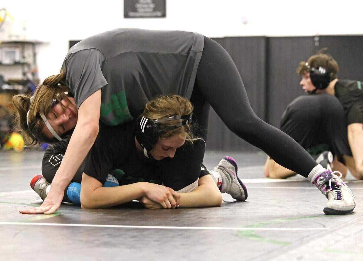 Azle wrestler Kenzie Harris pins Noah Kovach to the mat during one of the final practices before the state championship meet at Azle High School in Azle, Texas, on Friday, Feb. 9, 2026.
