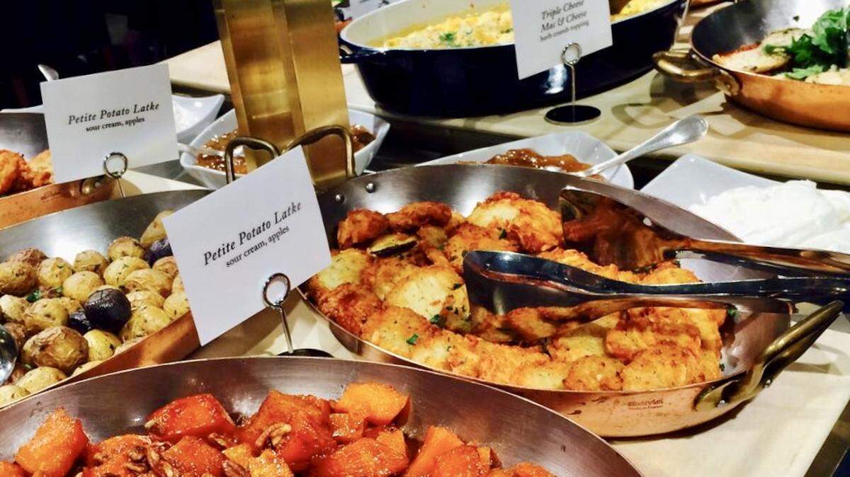 Potato latkes are among the items on the daily holiday buffet at the Zodiac inside the downtown Dallas Neiman Marcus.